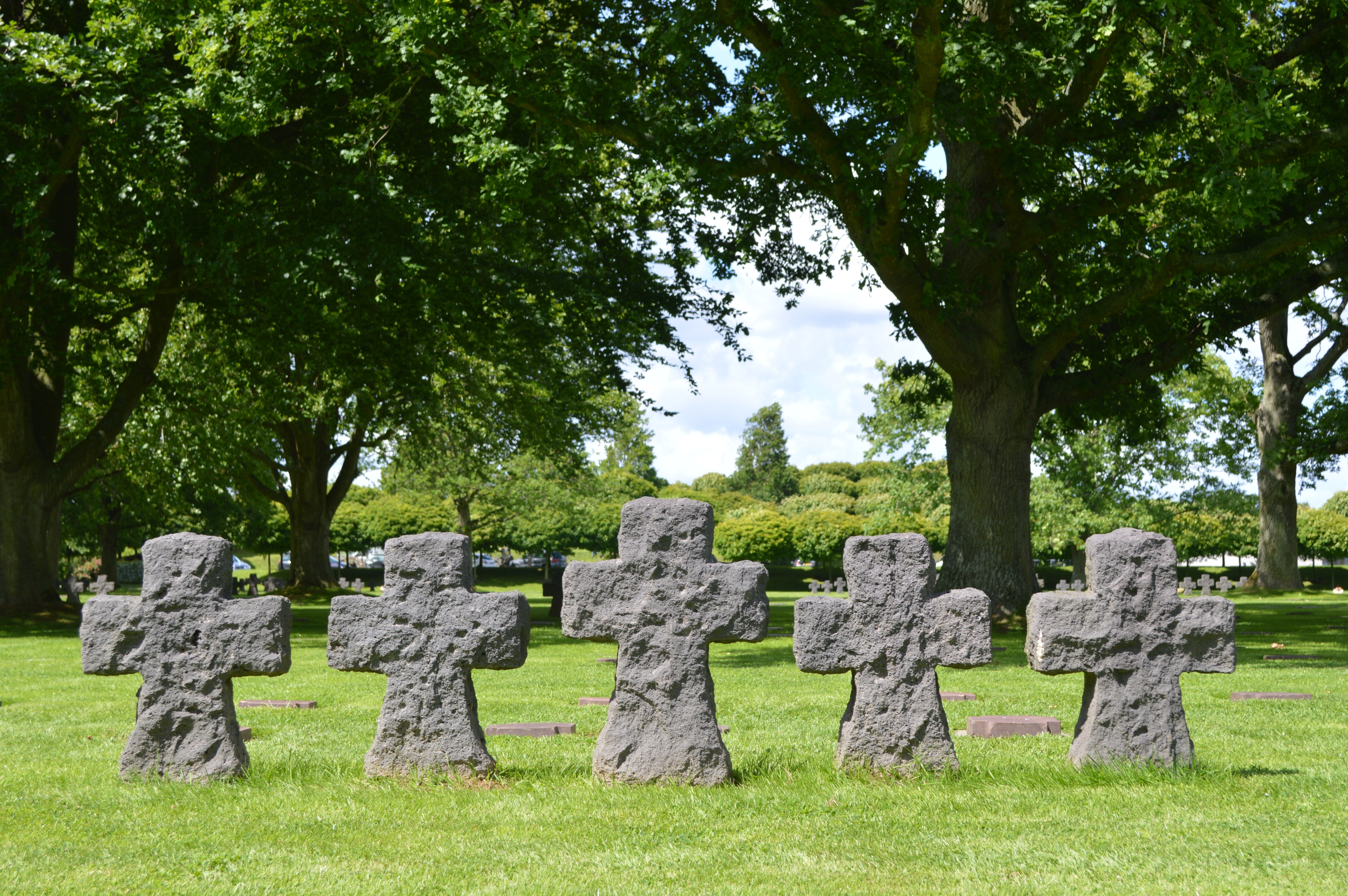 5 gray concrete cross tombstones