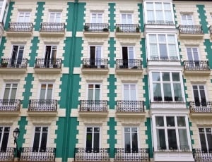 white and green high rise building thumbnail