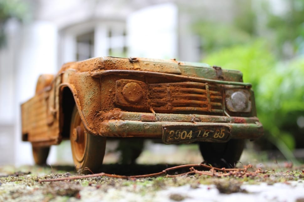 brown and green old car figurine preview