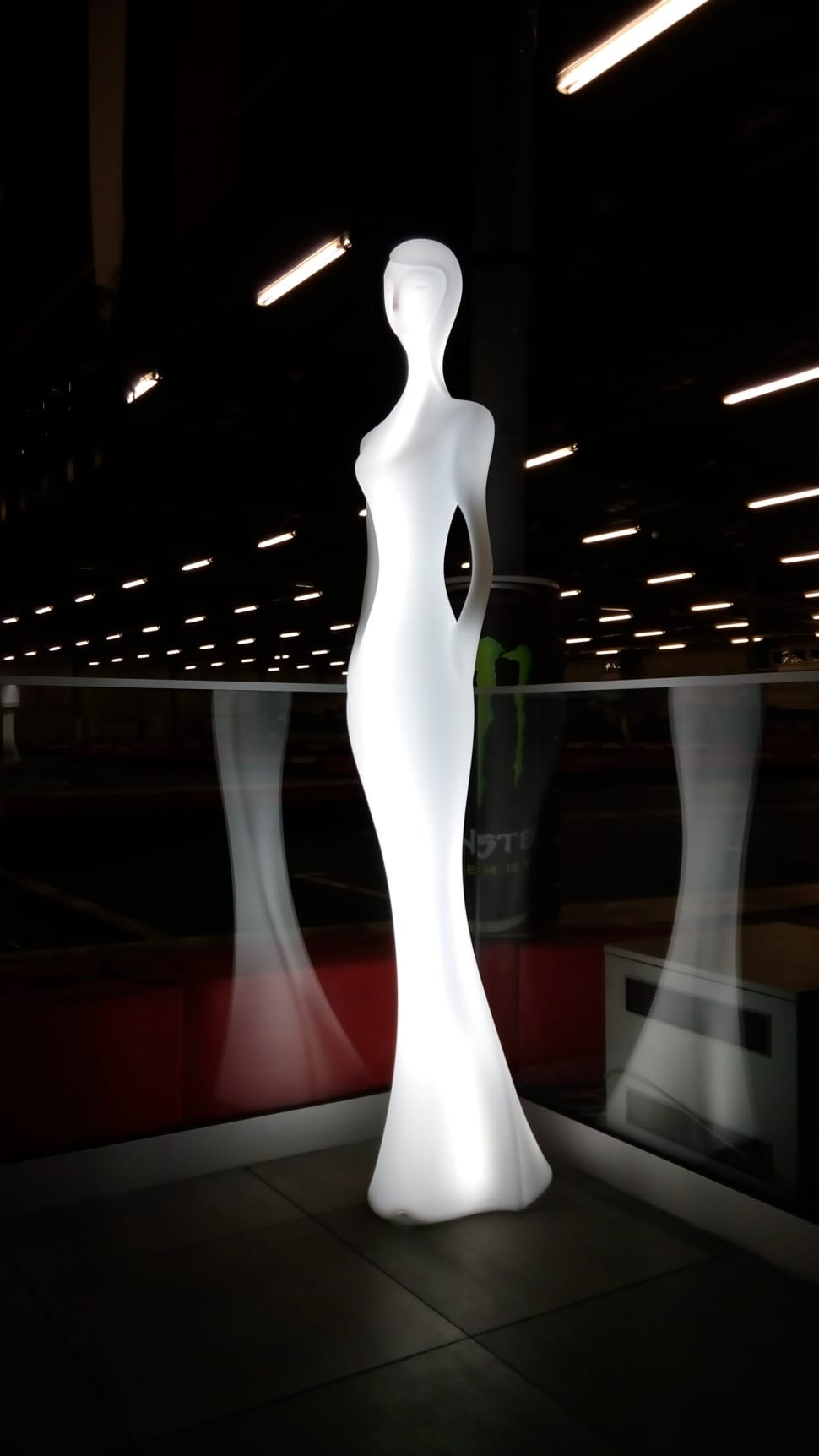 woman in dress lighted statue preview