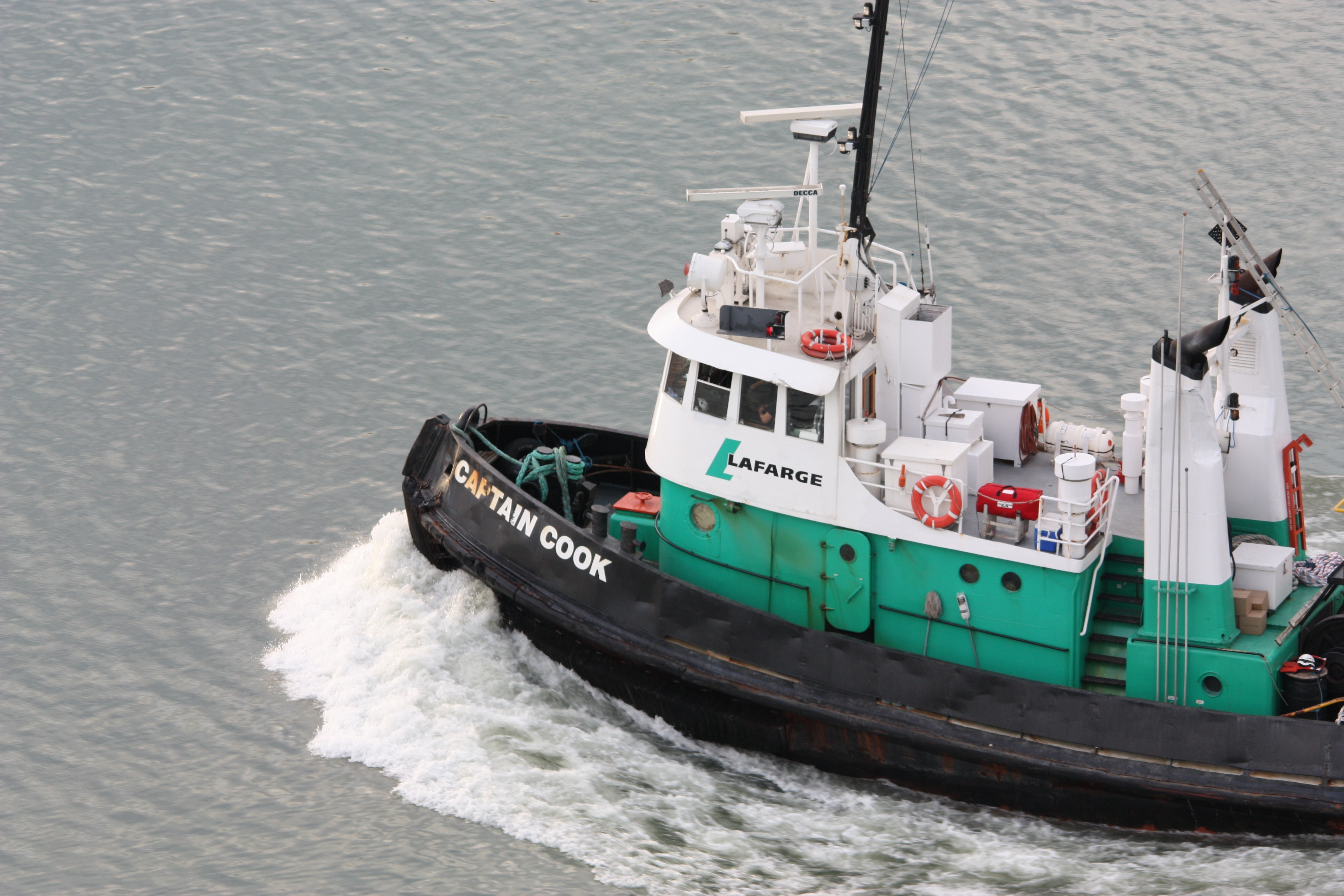 white teal and black captain cook tugboat
