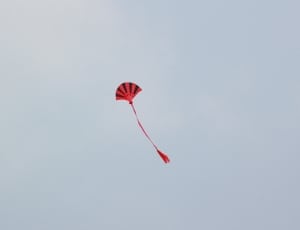 red and black hand fan shape kite thumbnail