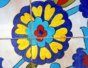 blue yellow and red round flower print floor tiles thumbnail