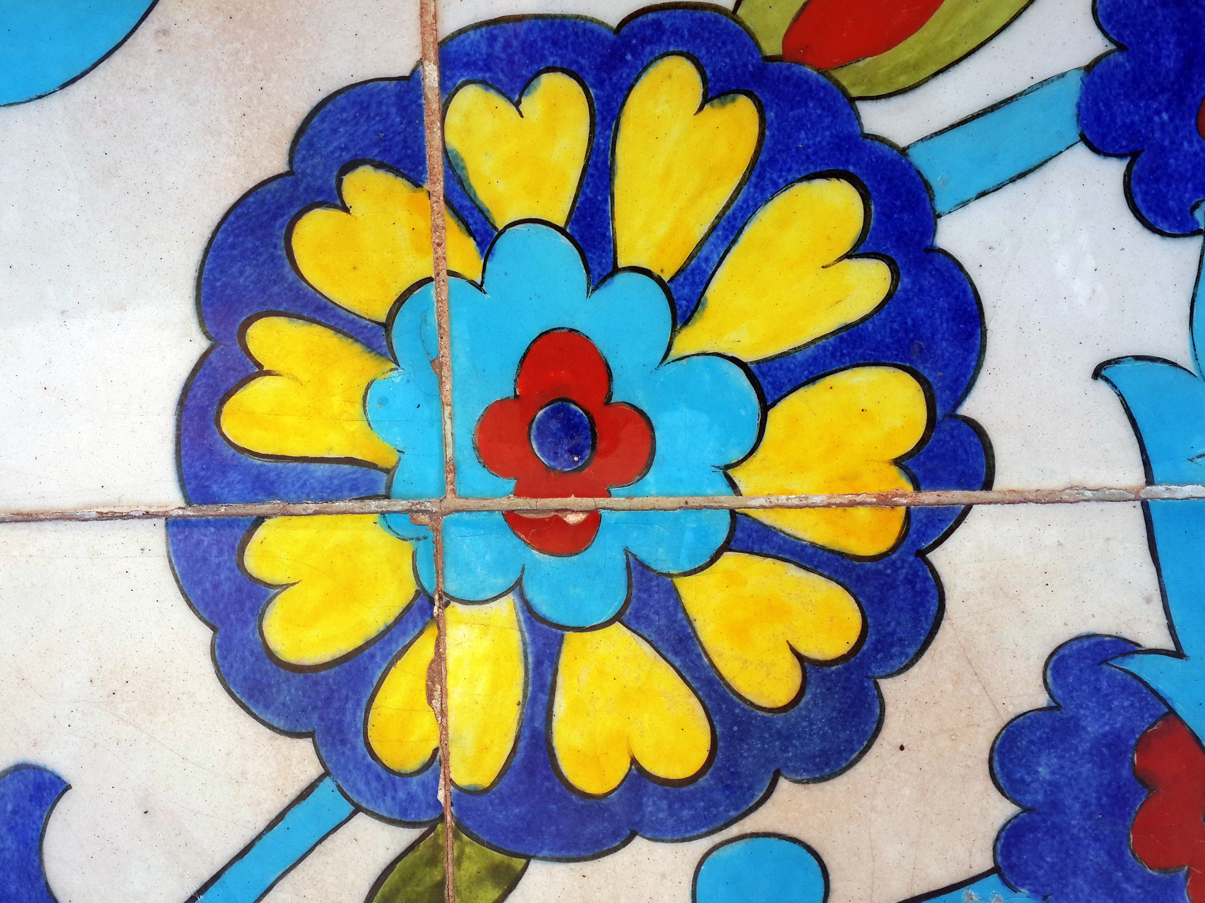 blue yellow and red round flower print floor tiles
