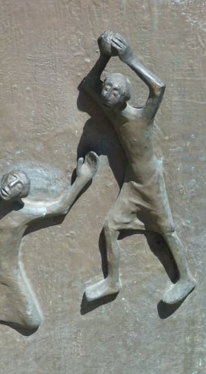 two person raising hands sculpture thumbnail
