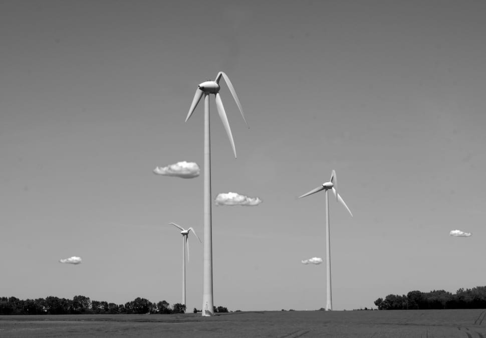 windmills under cloudy sky photo preview