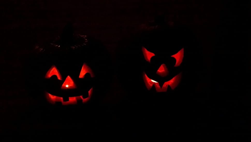 two lighted jack o lanterns in dark preview