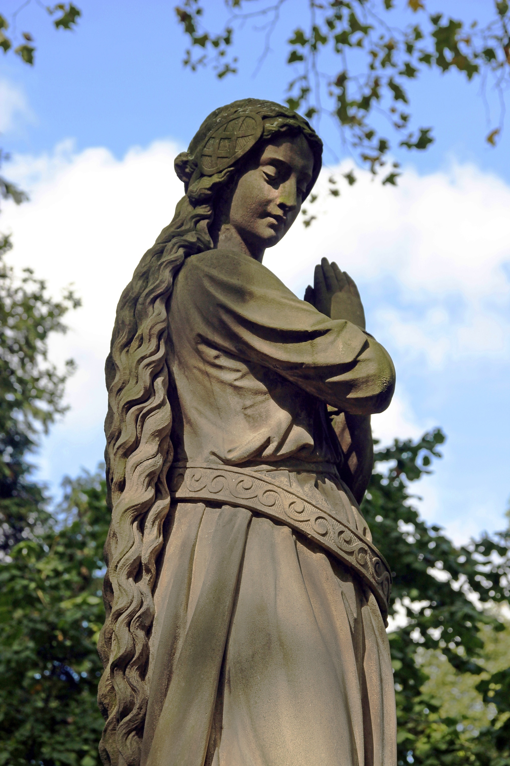 women gray clay statue