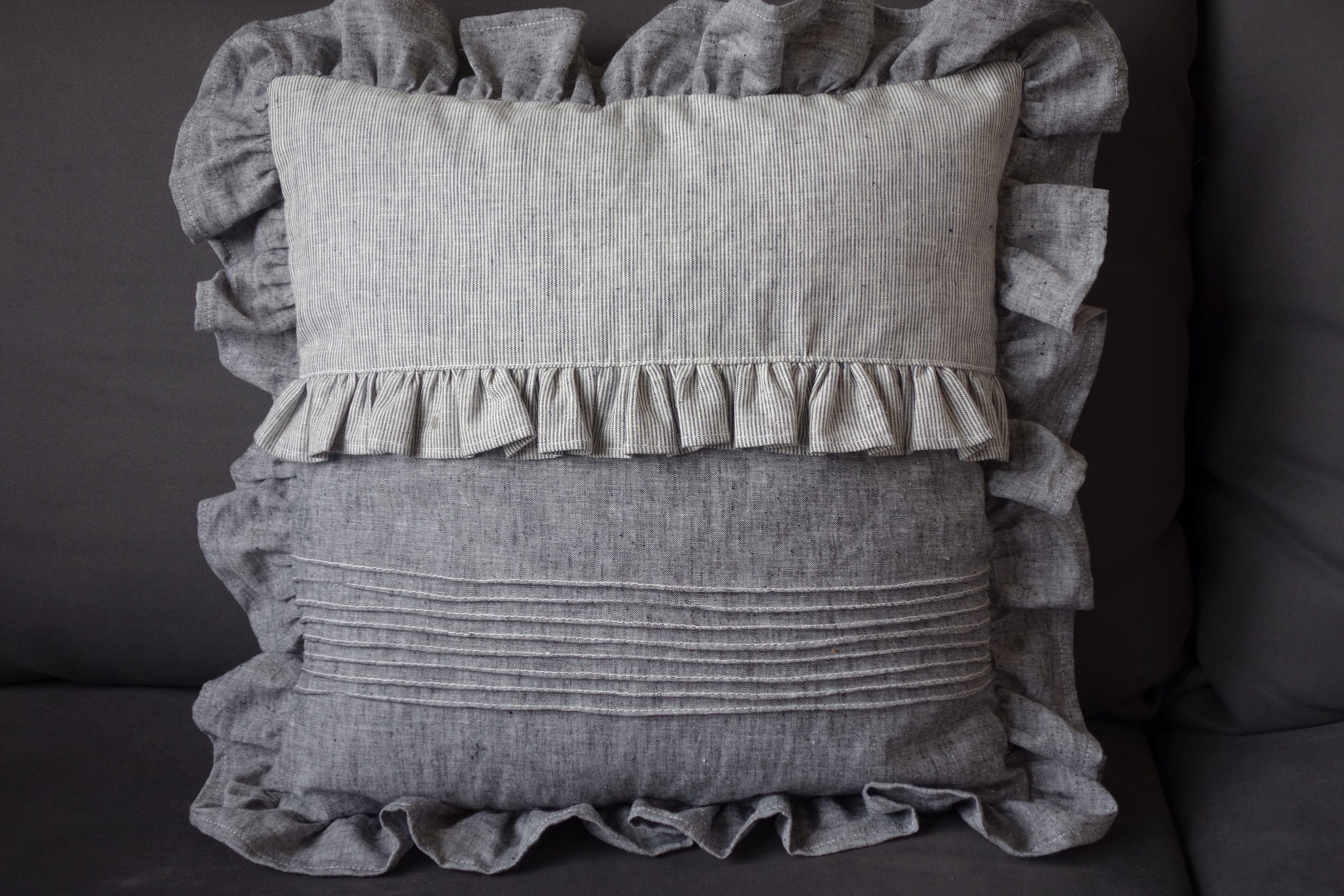 white grey square pillow