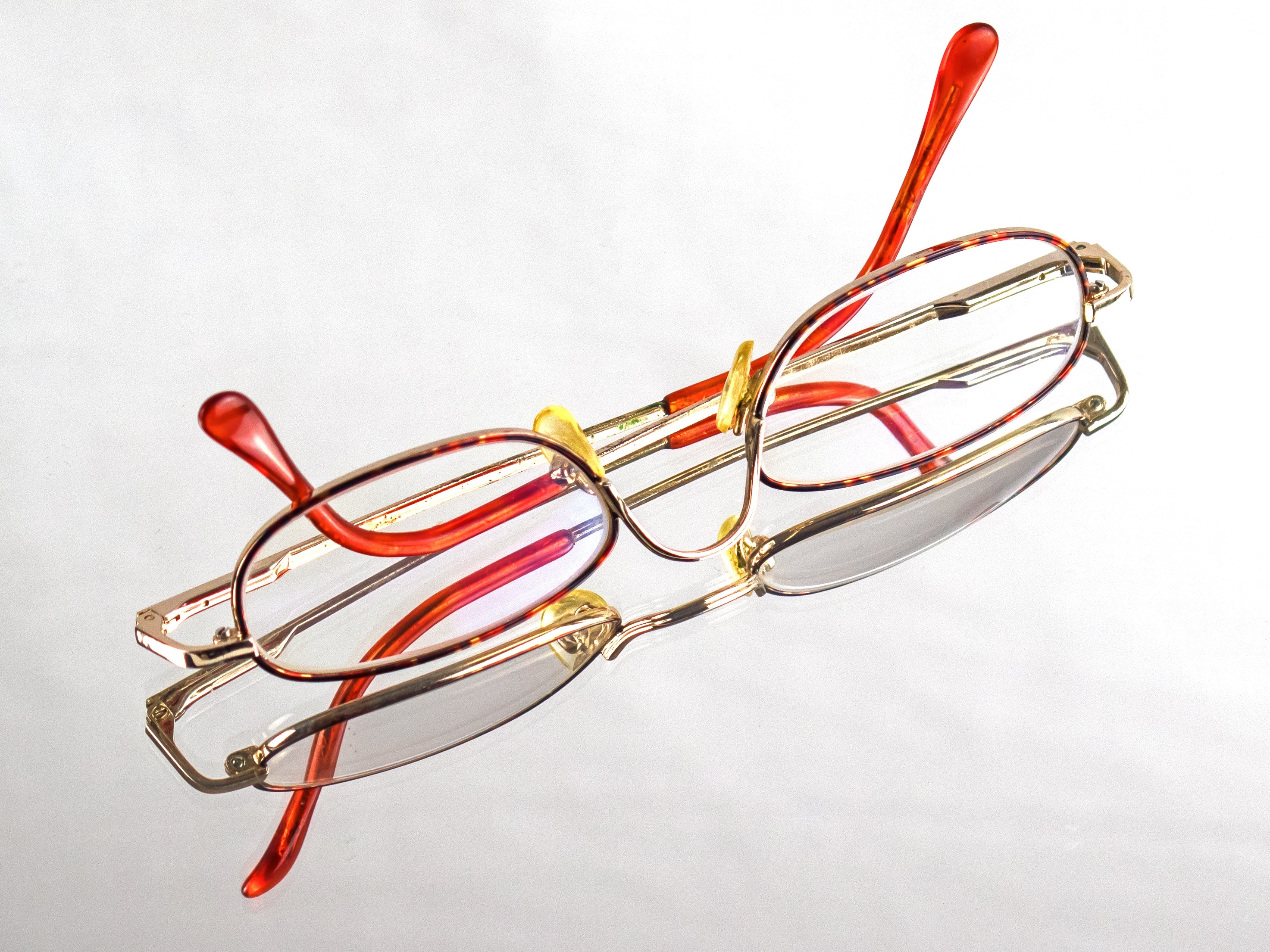 red and gold frame eyeglasses