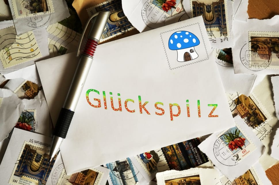 grey click pen and gluckspilz envelop preview