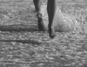 greyscale photo of person on water\ thumbnail