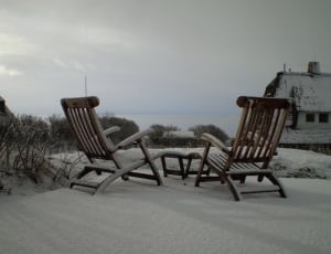 2 brown wooden loungers thumbnail