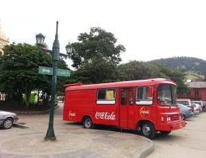 coca cola bus near signage thumbnail