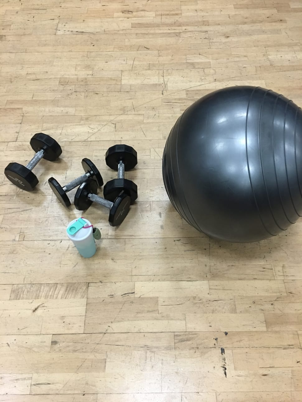 black stability ball and pair of dumbbells preview