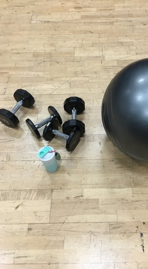 black stability ball and pair of dumbbells thumbnail