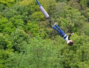 woman in blue jeans bungee jumping thumbnail