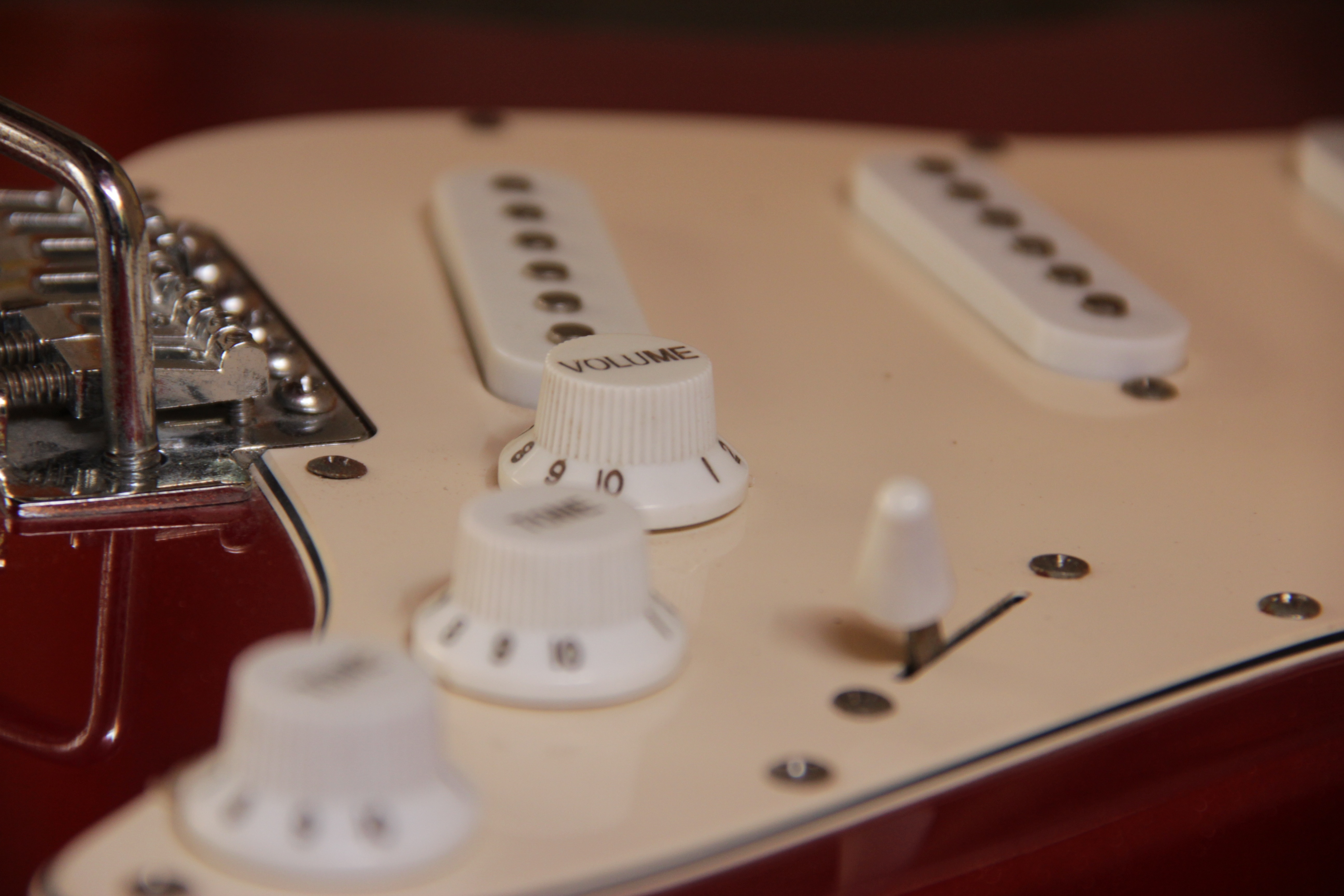 red and white electric guitar