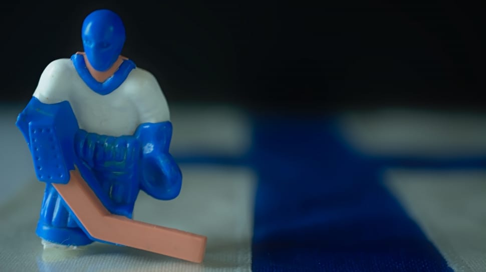 white and blue ice hockey player plastic figurine preview