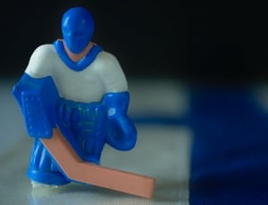 white and blue ice hockey player plastic figurine thumbnail