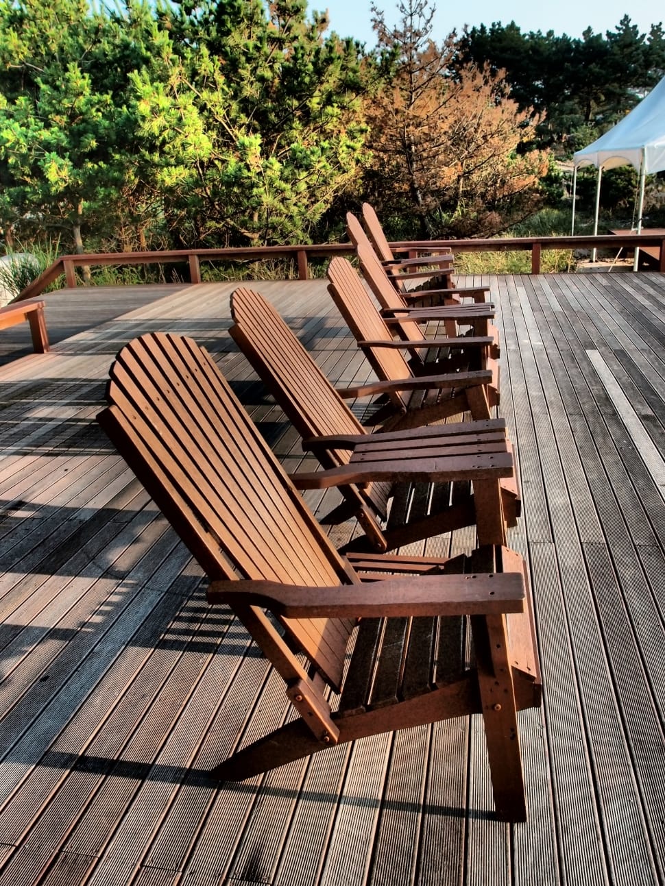 6 brown wooden adirondack chairs preview