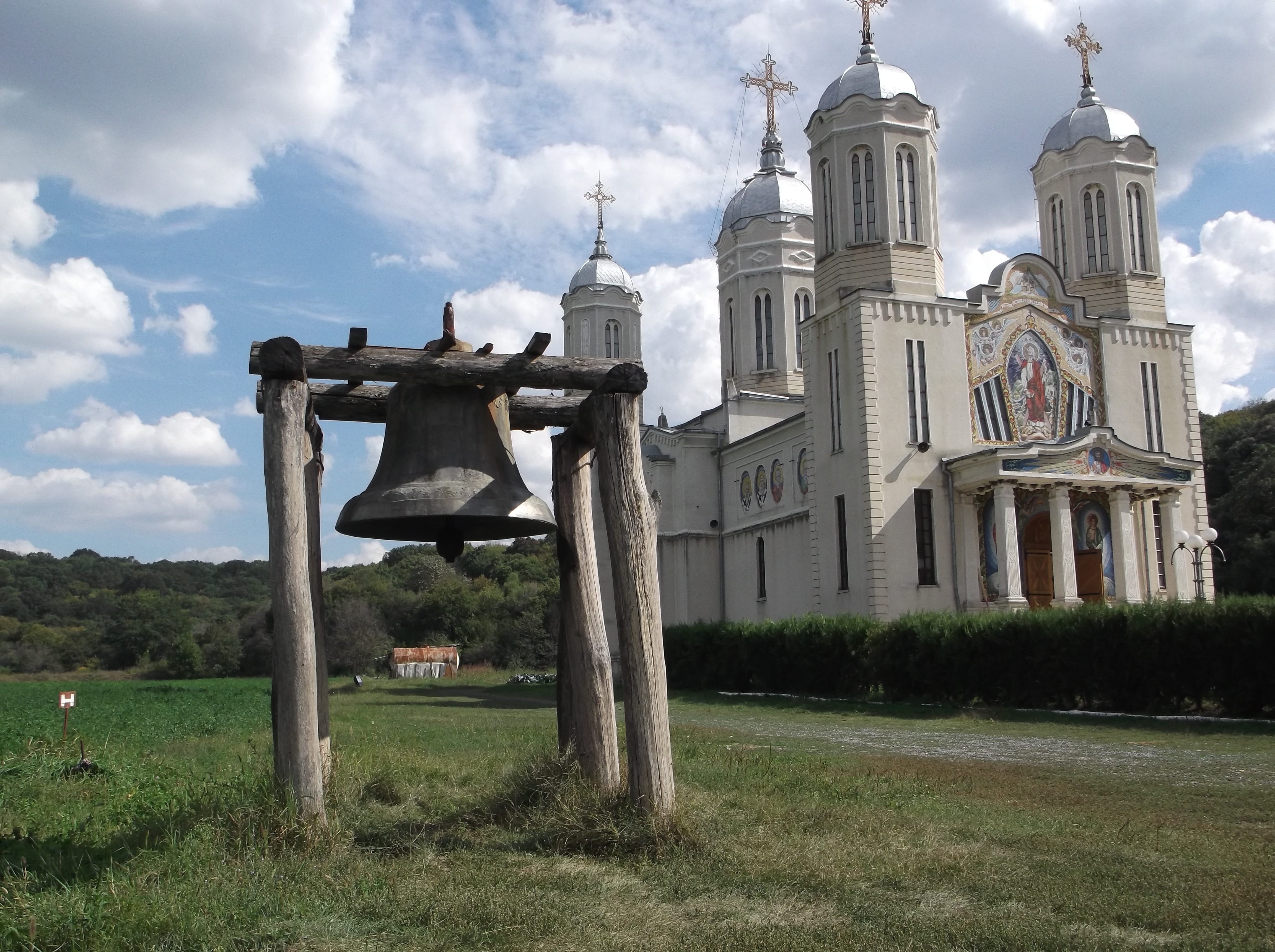 white cathedral church with bell