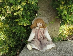 brown and white dressed girl doll thumbnail