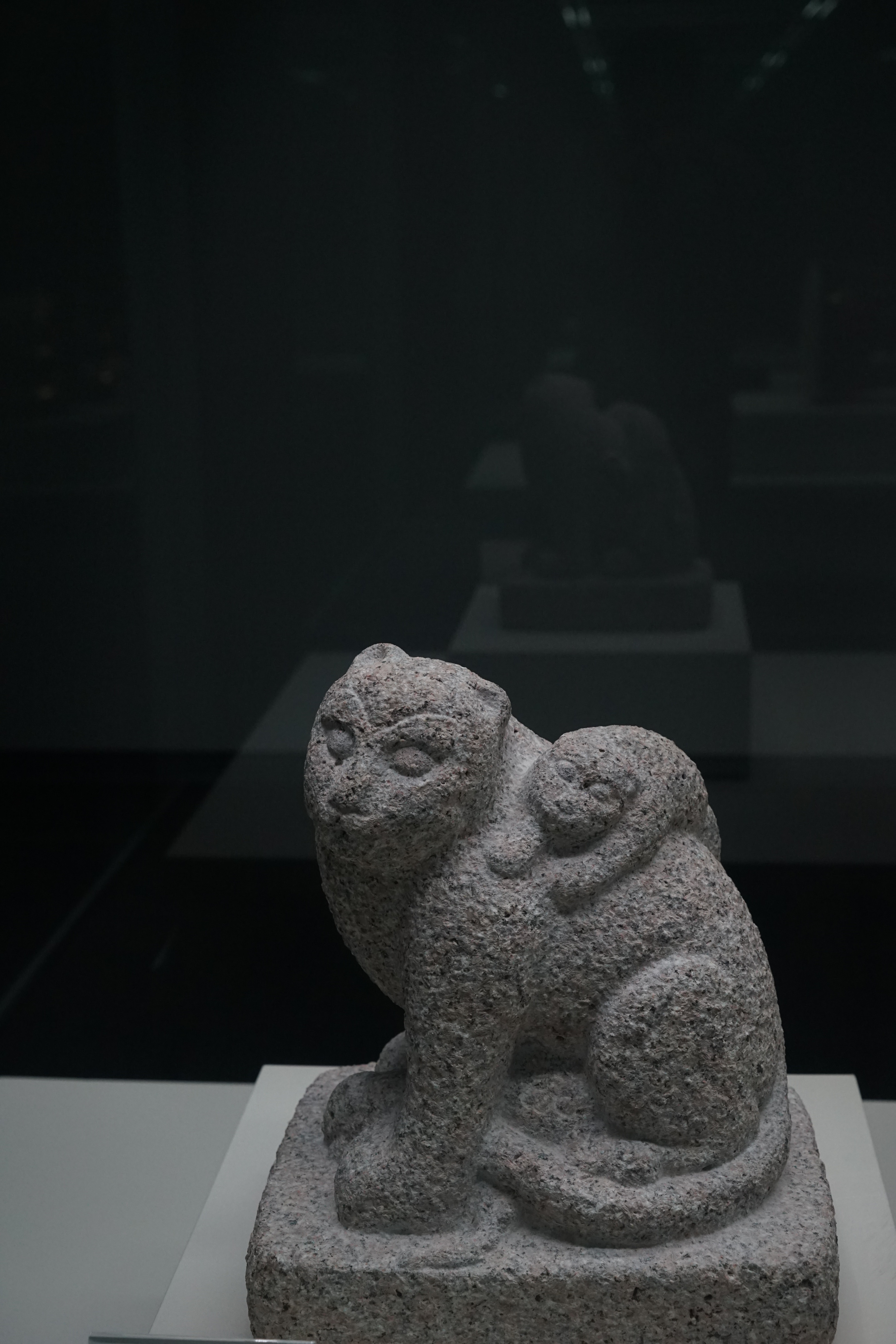 gray ceramic monkey figurines