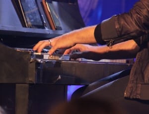 brown leather jacket and black grand piano thumbnail