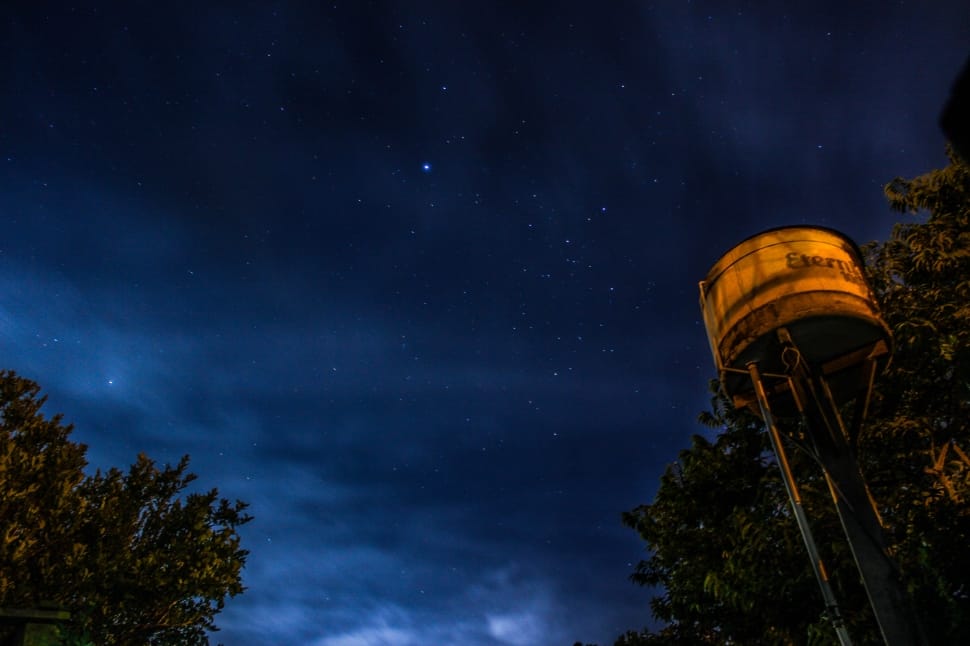 midnight photography of water tank under starry night preview