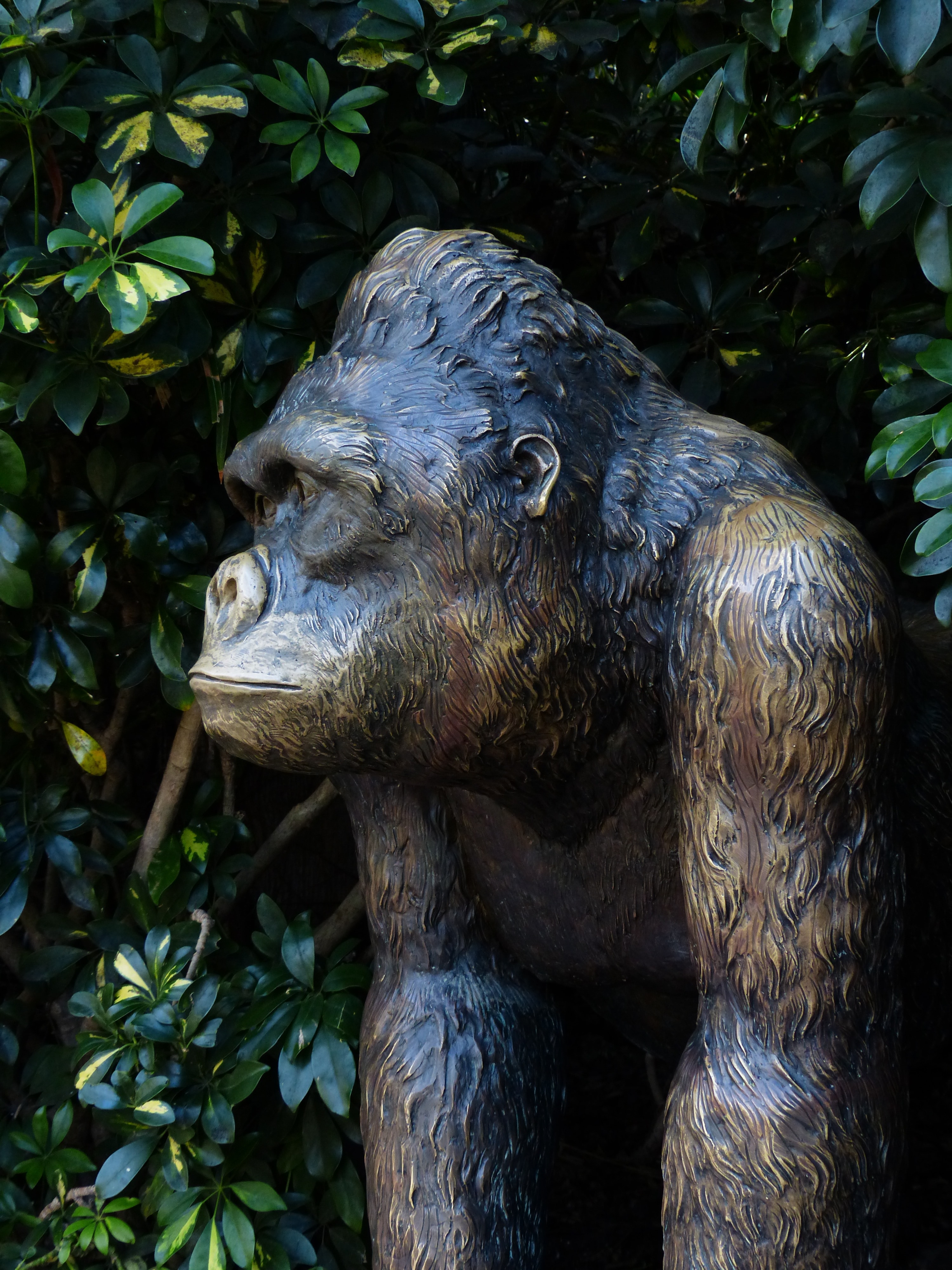 black and brown gorilla concrete statue
