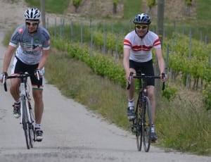 1 white and 1black road bicycles thumbnail