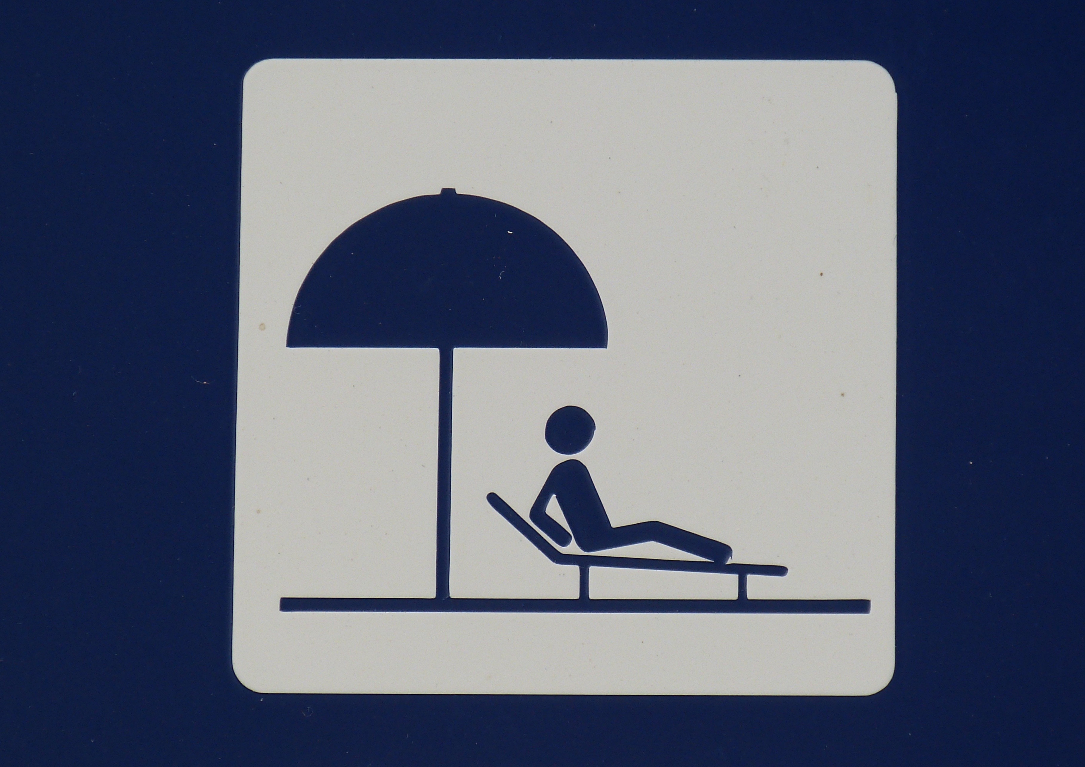 man figure on lounger under umbrella illustration