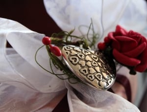 silver emblem with red rose thumbnail