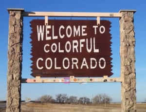 brown wooden welcome to colorful colorado signage thumbnail