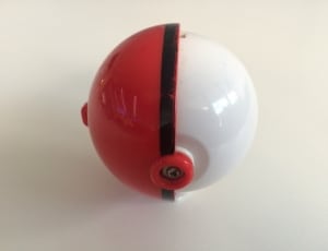 red black and white plastic pokeball toy thumbnail