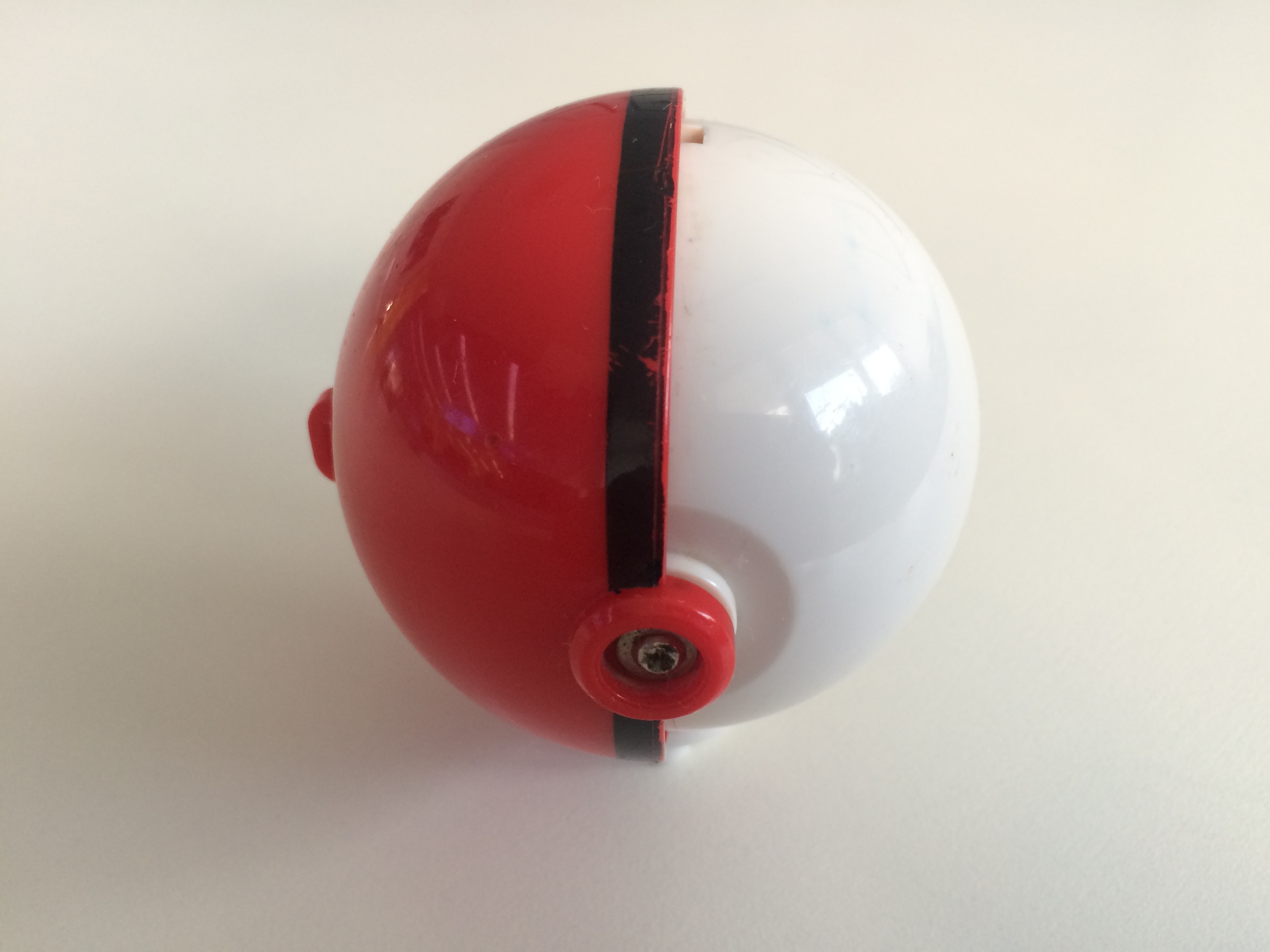red black and white plastic pokeball toy