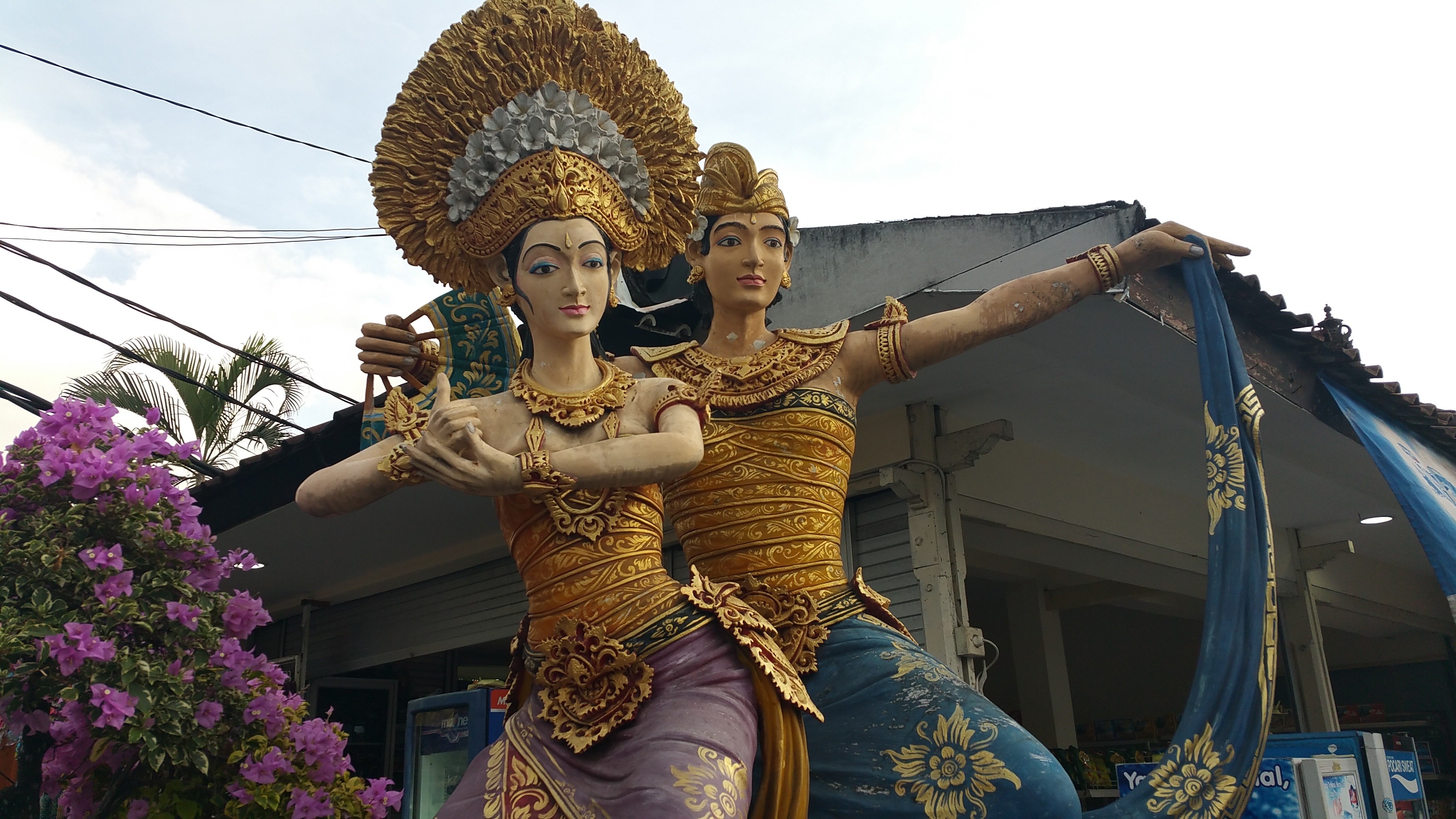 couple in traditional dress statues