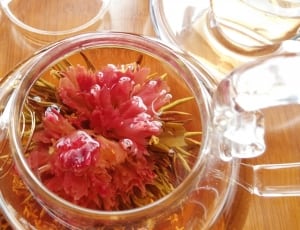 clear glass teapot with red flower thumbnail