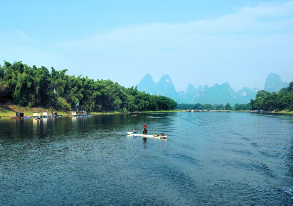 man in float boat on water preview