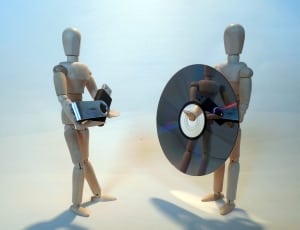 brown wooden mannequins with disc and flashdrive thumbnail