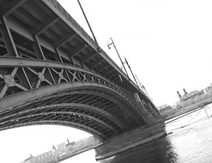 gray scale photo of metal bridge thumbnail