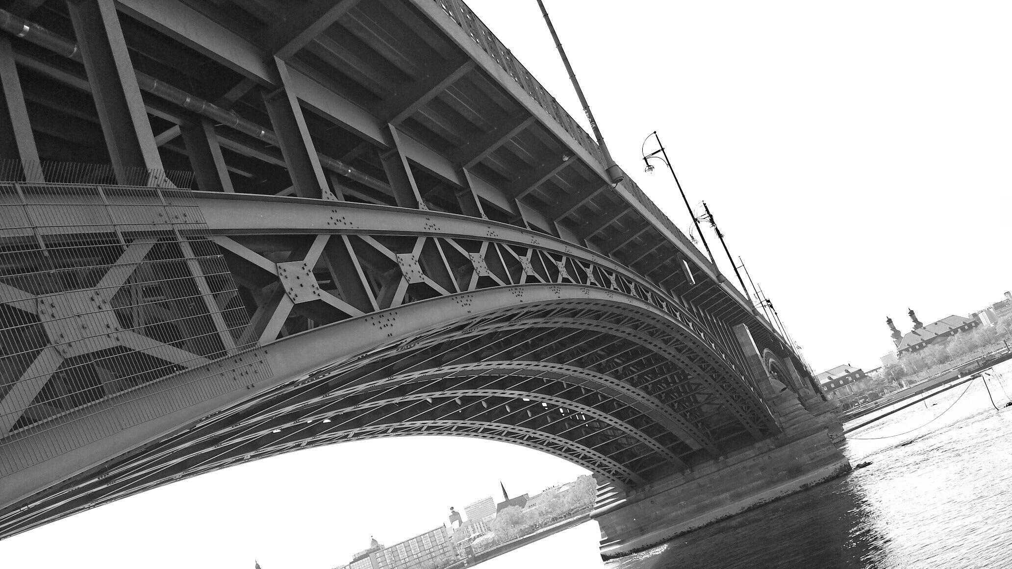 gray scale photo of metal bridge