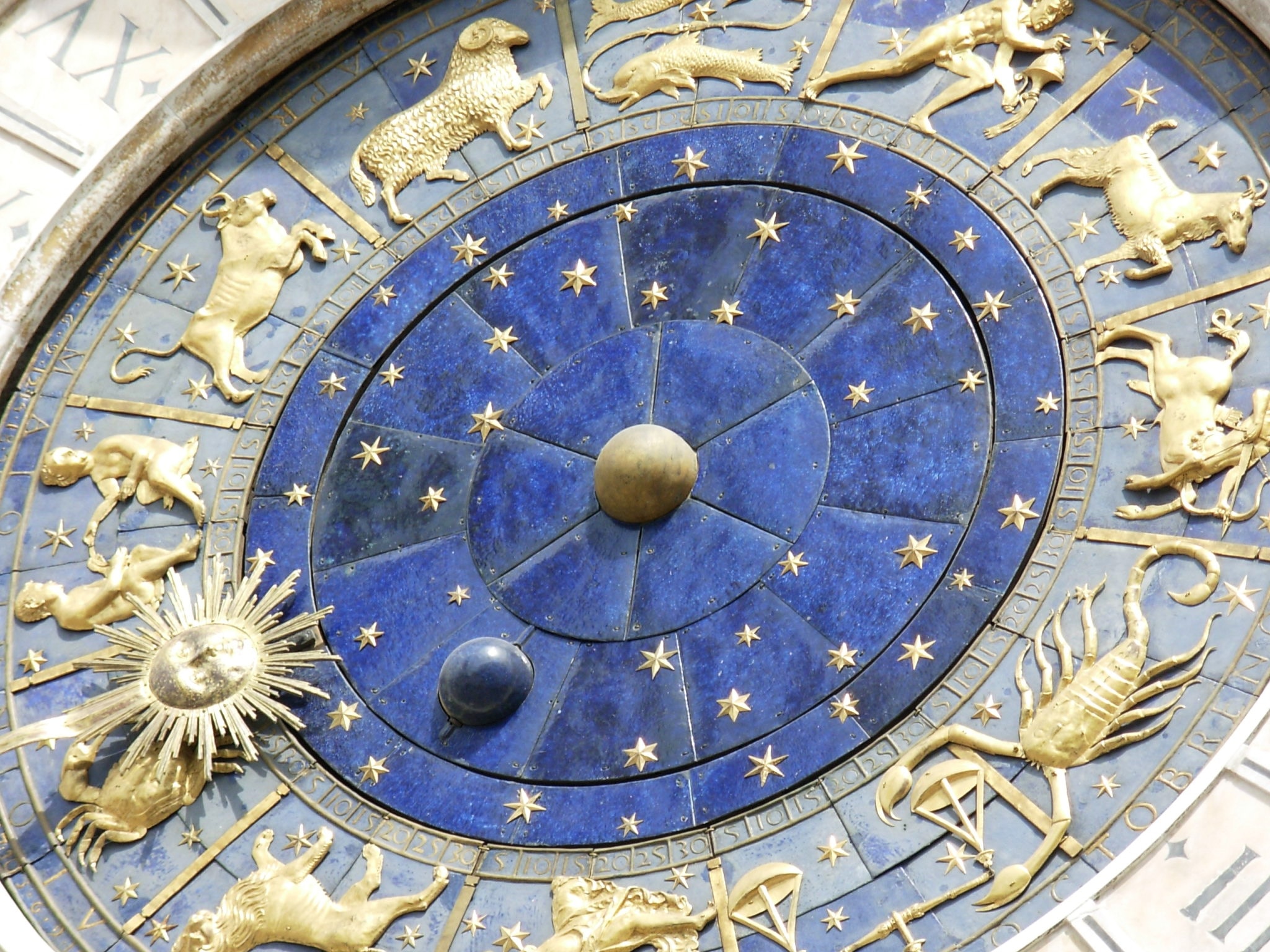 gold blue and white zodiac sign