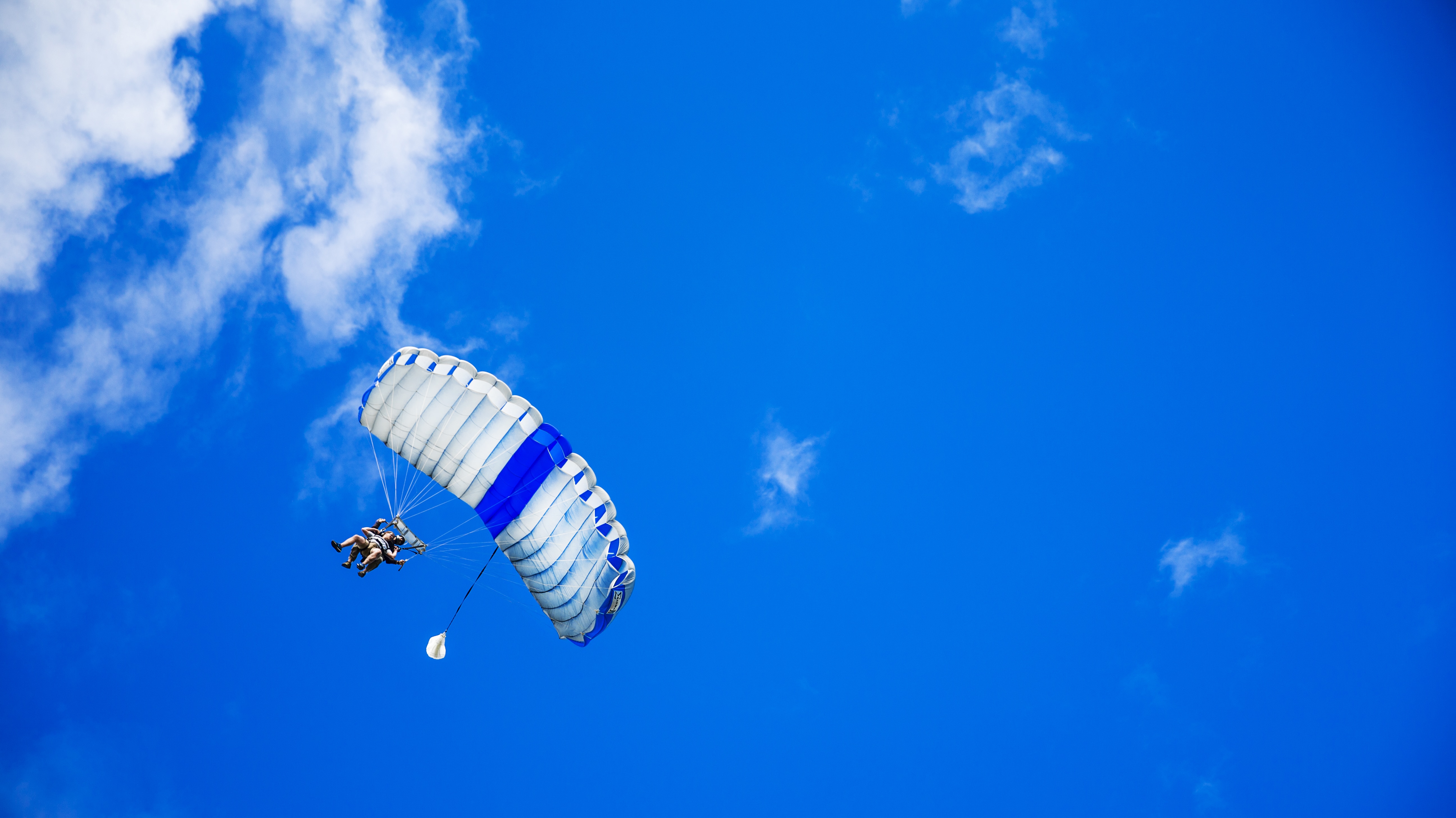 man riding parachute