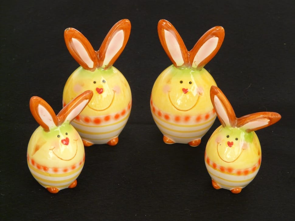 white yellow and orange ceramic rabbit figures preview