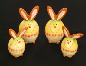 white yellow and orange ceramic rabbit figures thumbnail