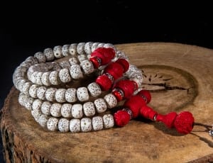 4 white and red beaded bracelets thumbnail