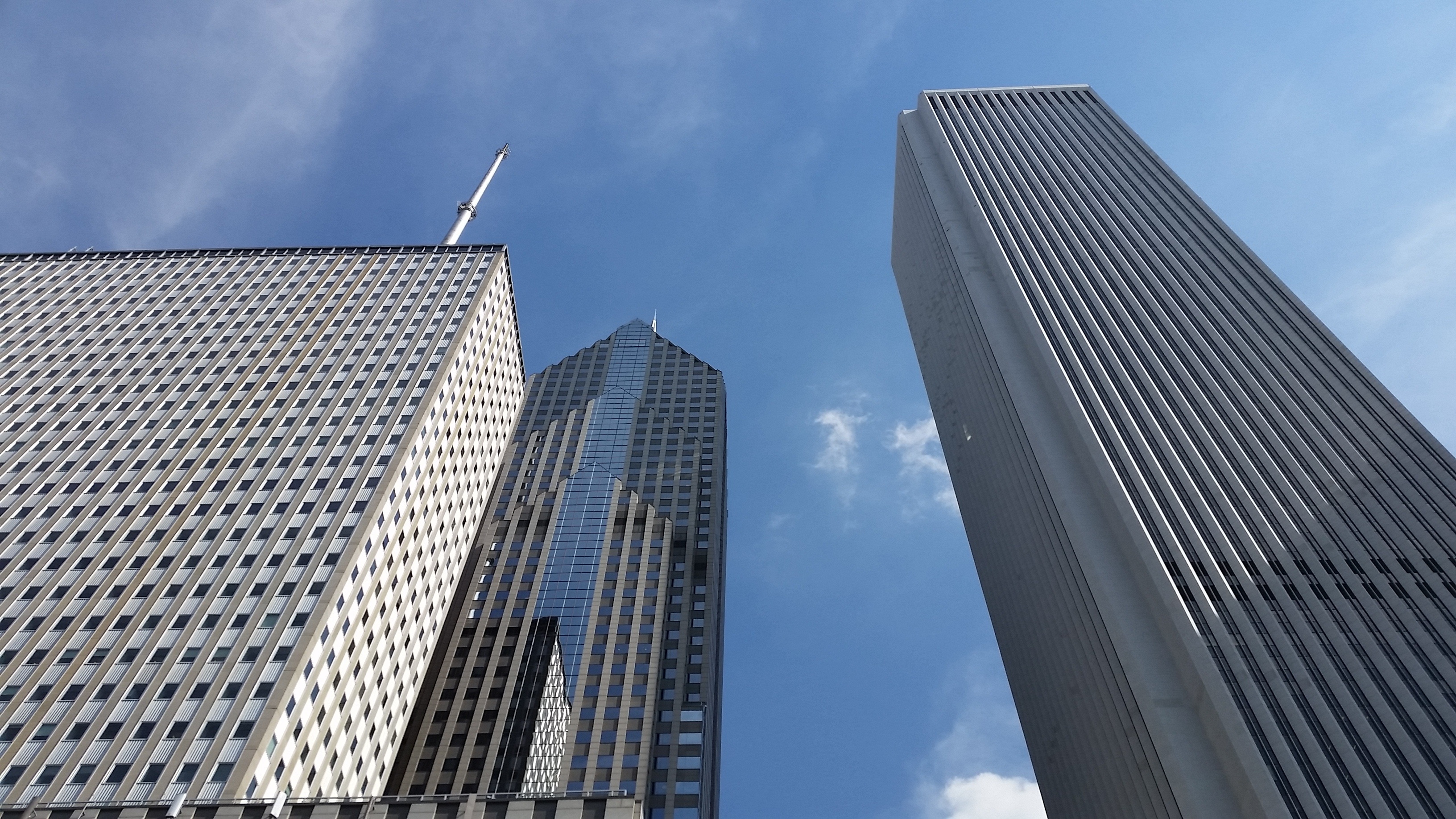 three concrete high-rise buildings