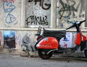 black and red moped scooter thumbnail